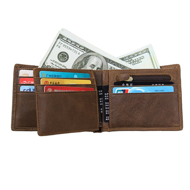 Brown leather wallet with money and cards on a white background