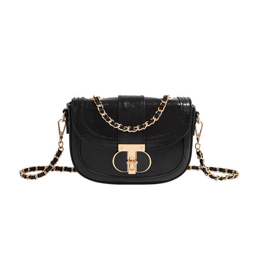 Black handbag with gold chain strap on a white background